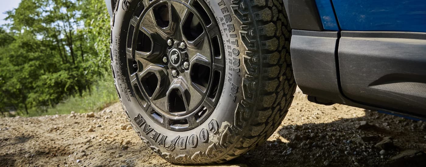 Black rim and tire on a 2025 Ford Bronco off-road