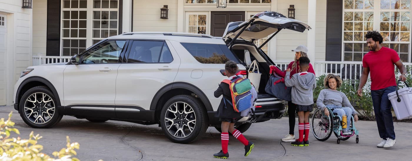 A white 2025 Ford Explorer parked on a driveway.