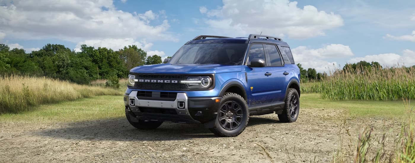 Blue 2026 Ford Bronco Sport parked off-road.