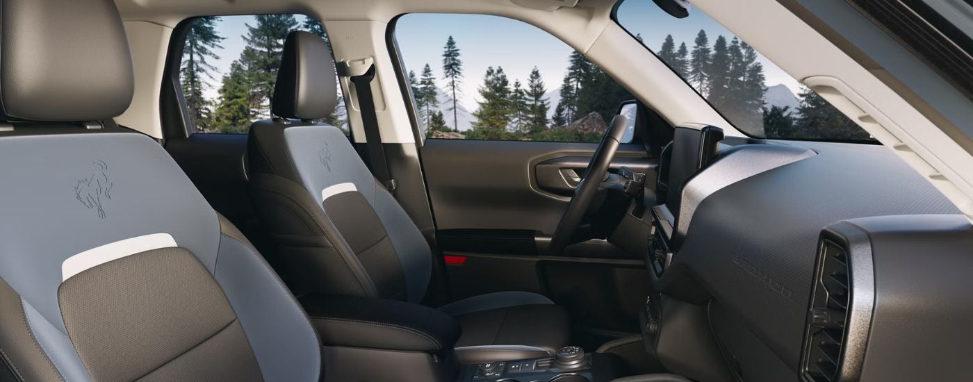 2026 Ford Bronco Sport blue and gray interior showing front seats and steering wheel.