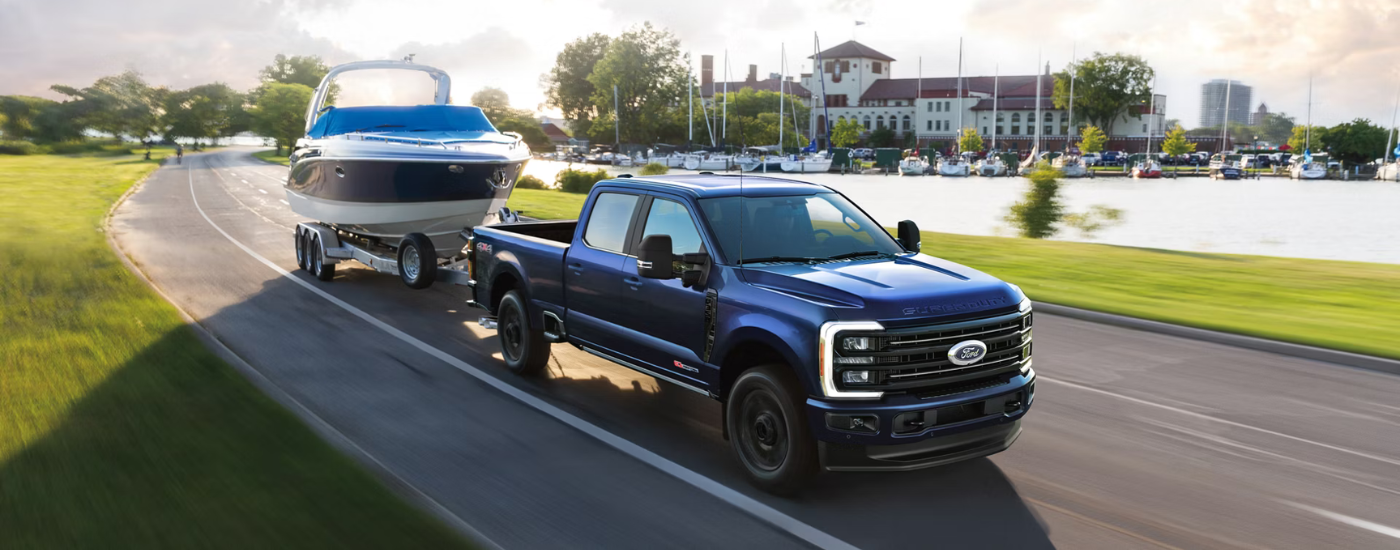 Blue 2026 Ford F-250 SD towing a boat