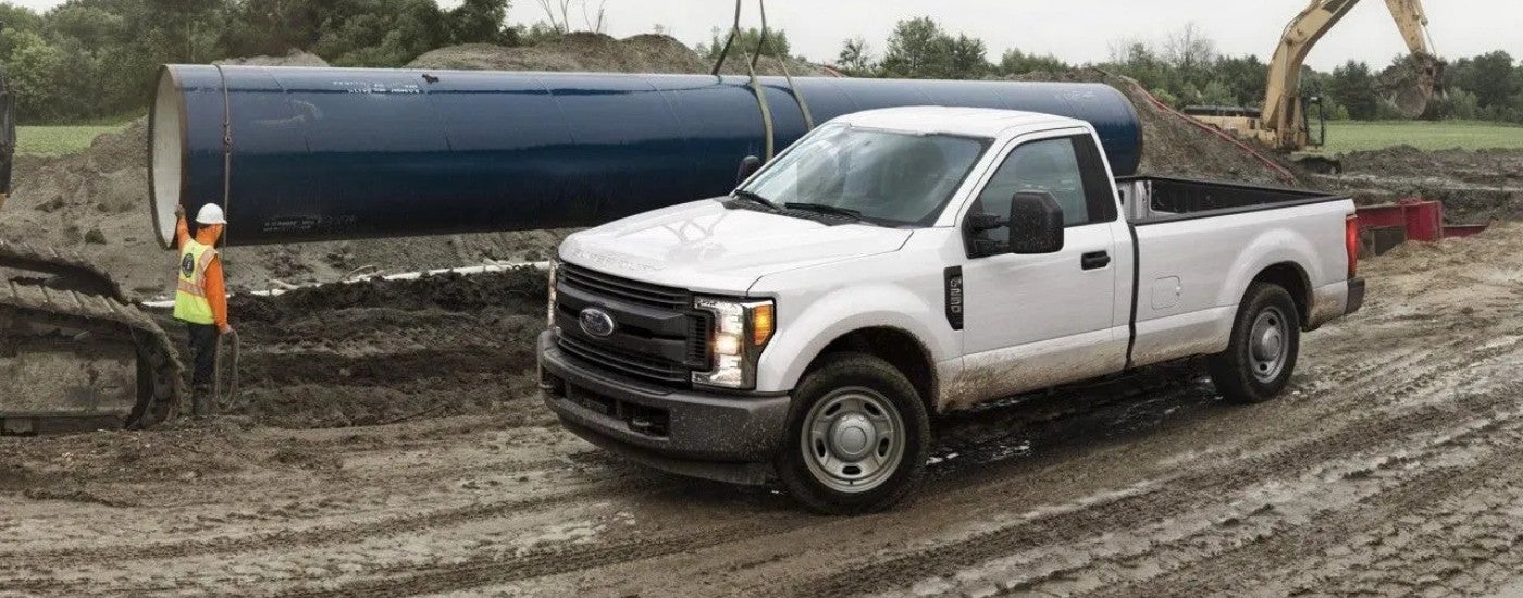 A white 2017 Ford F-250 at a construction site.