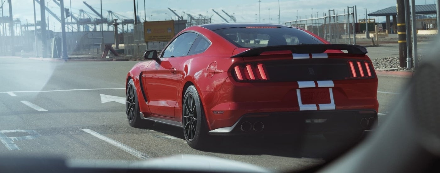 Red 2020 Ford Mustang GT350 driving on city street