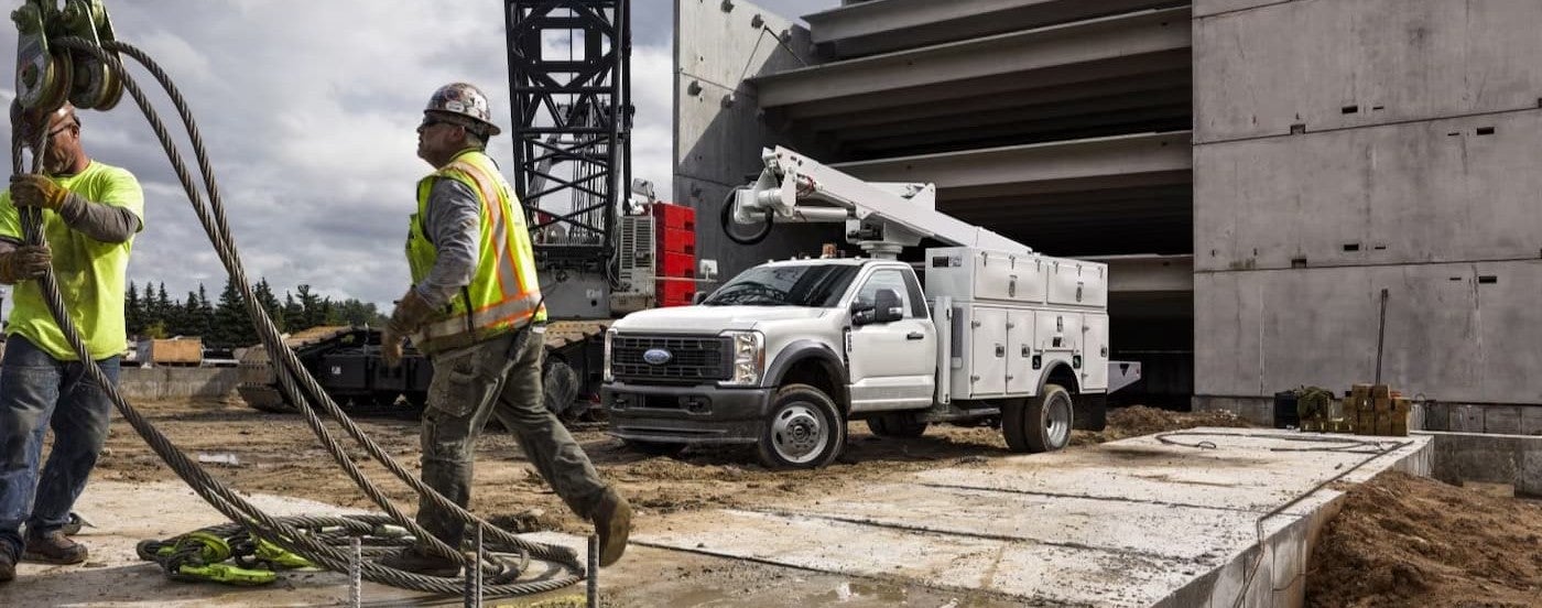 A white 2026 Ford F-550 parked on a job site.