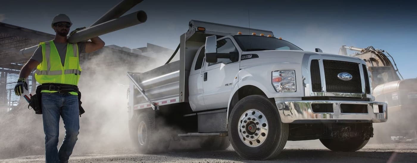 A white 2026 Ford F-650 parked on a job site.